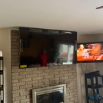 TV on Brick Wall